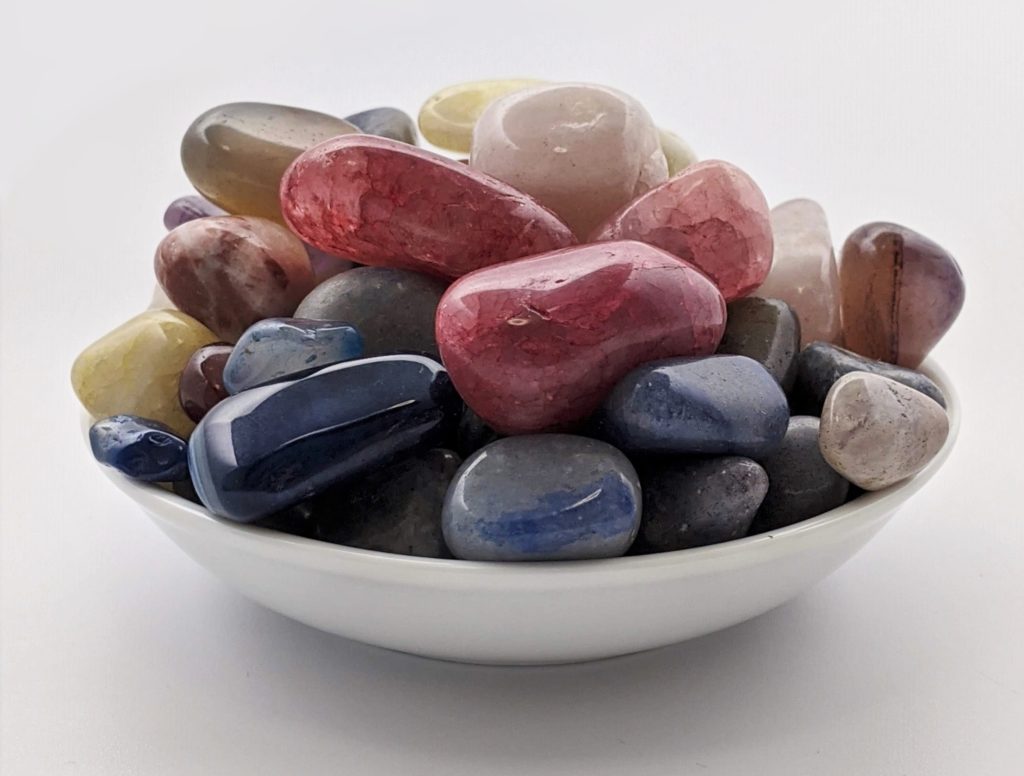 A bowl of polished gemstones